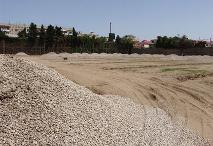 Laying of a football field with artificial turf